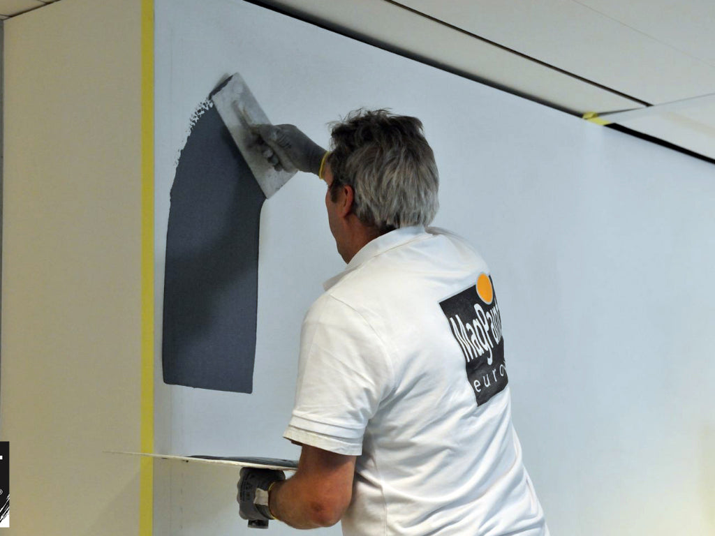 MagnetPlaster being installed onto a wall